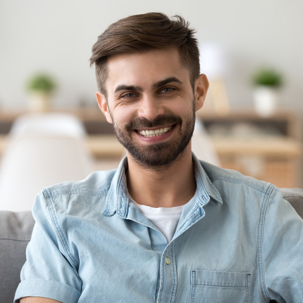 young man with brown hair smiling