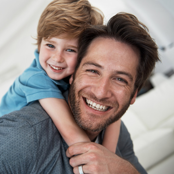 father and son smiling